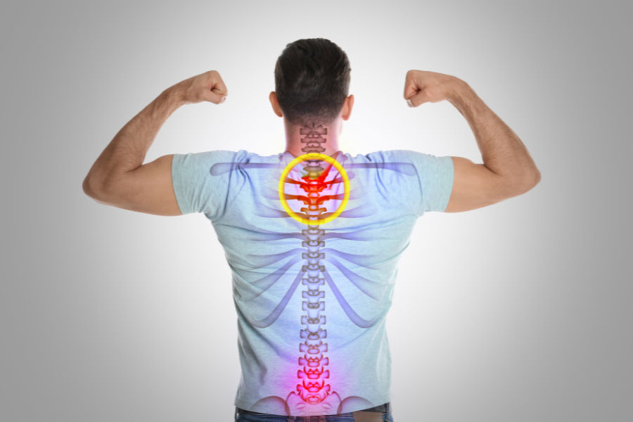 man posing to show stress on the spine