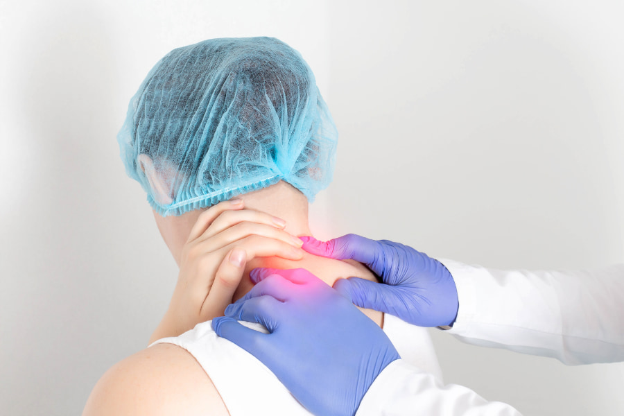 image of doctor testing a patient's neck pain