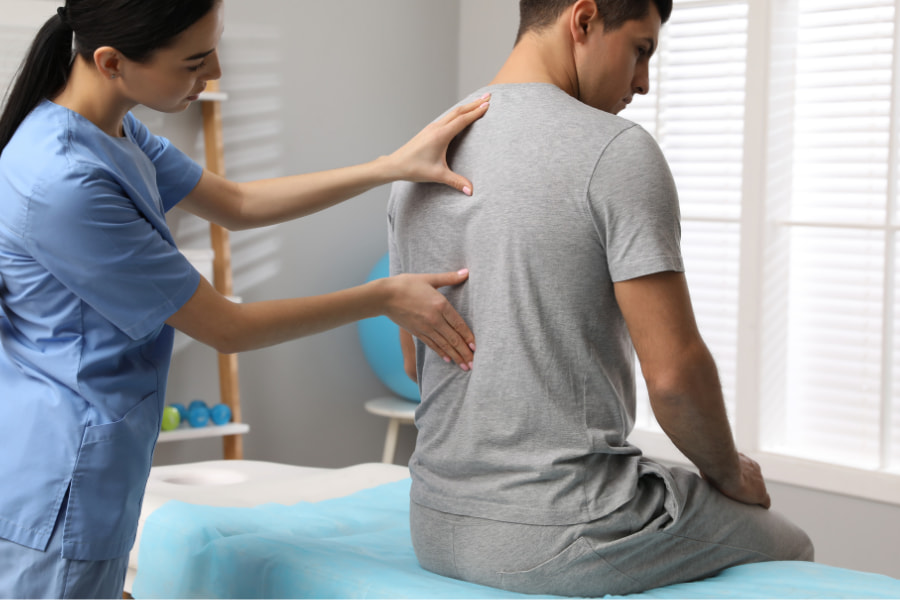 image of a man having his back medically examined